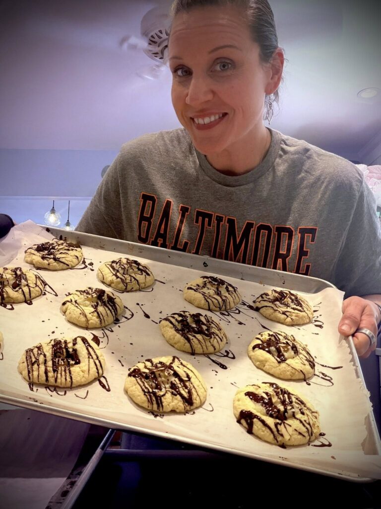 Mandy from Bear Creek Breads holds a tray of sourdough cookies.